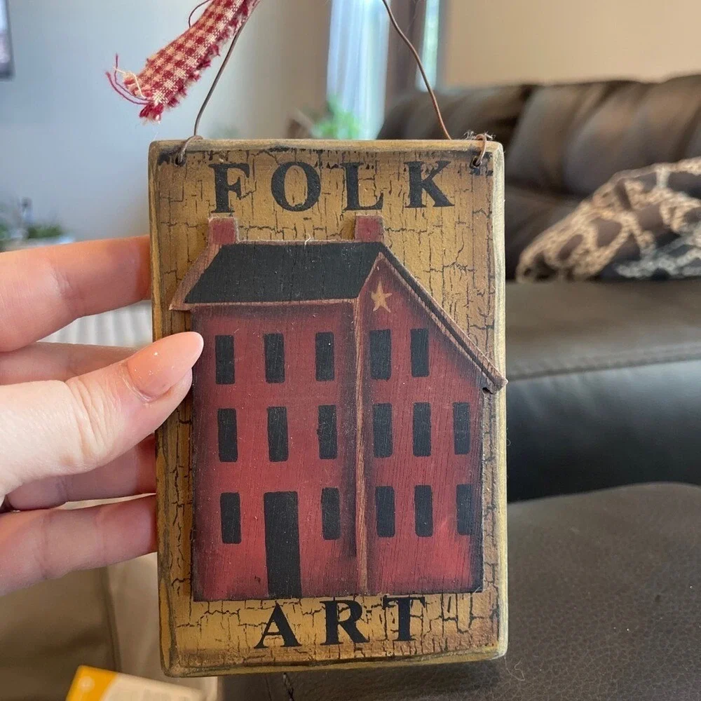 Folk Art Hanging Decor with Red and Gold Design